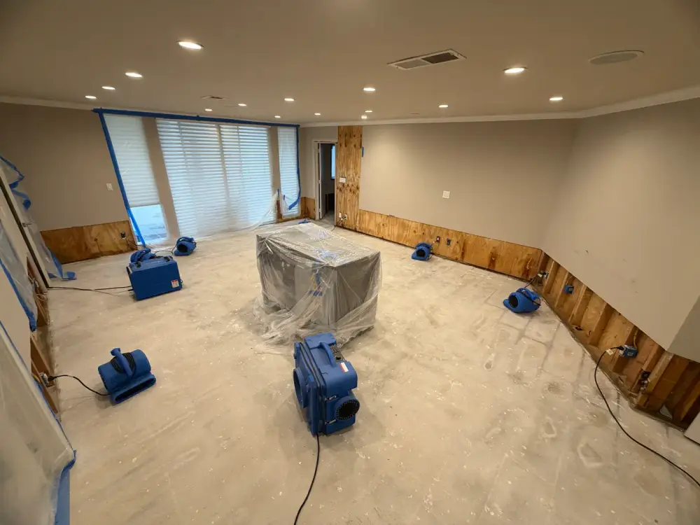 Fix & Restore technician on-site with a moisture meter and extraction truck